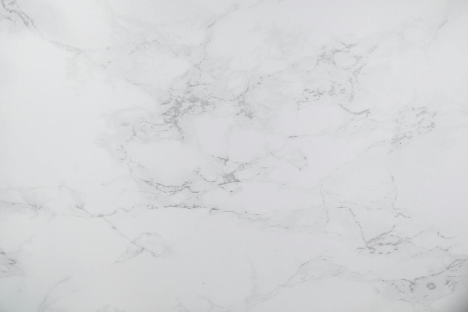 White marble texture with subtle gray veins, perfect for design backgrounds.